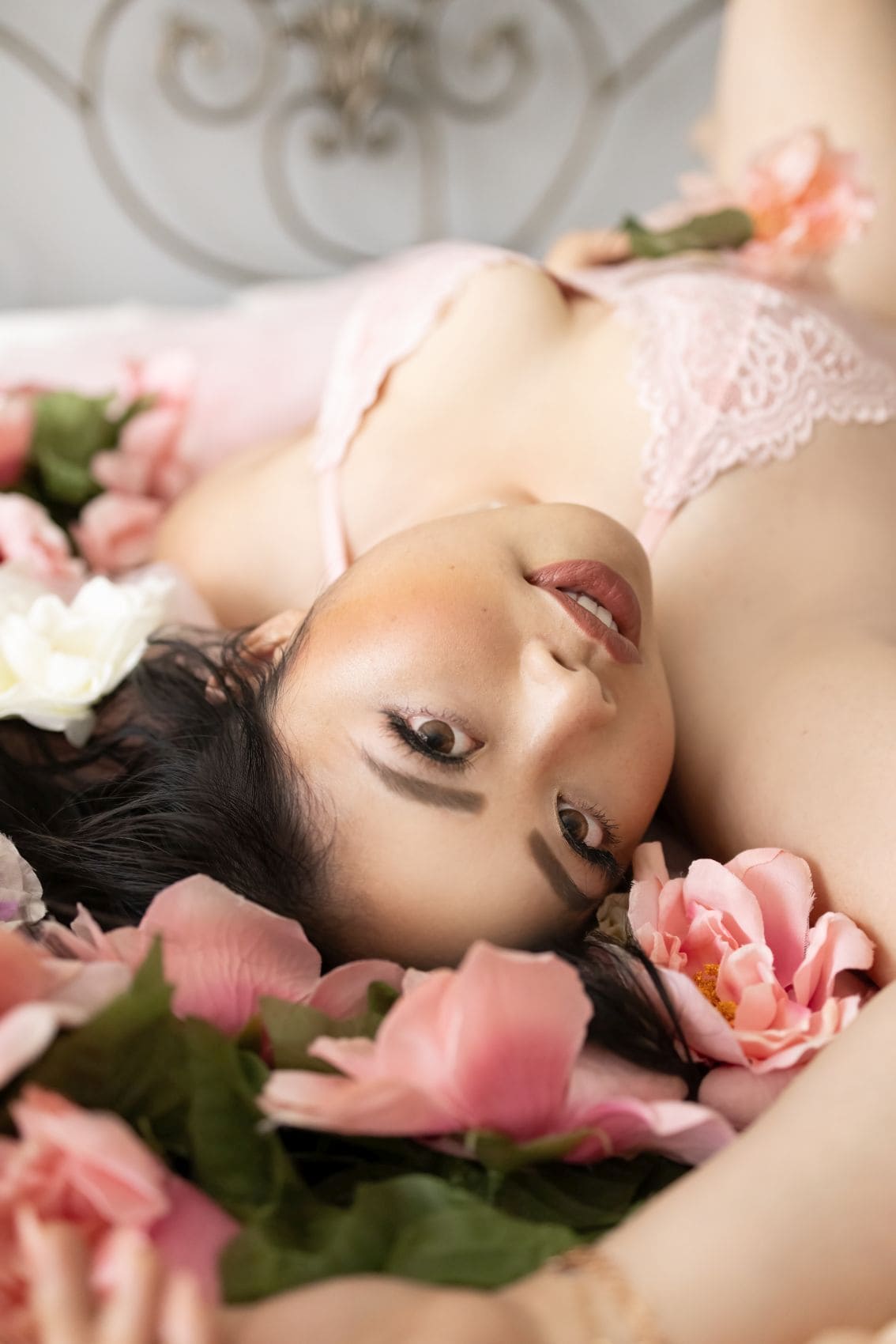 photo of a woman in lingerie surrounded with flowers